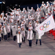 A volunteer carries the flag of the Olympic Athletes from Russia.